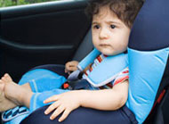 Toddler sitting in car seat